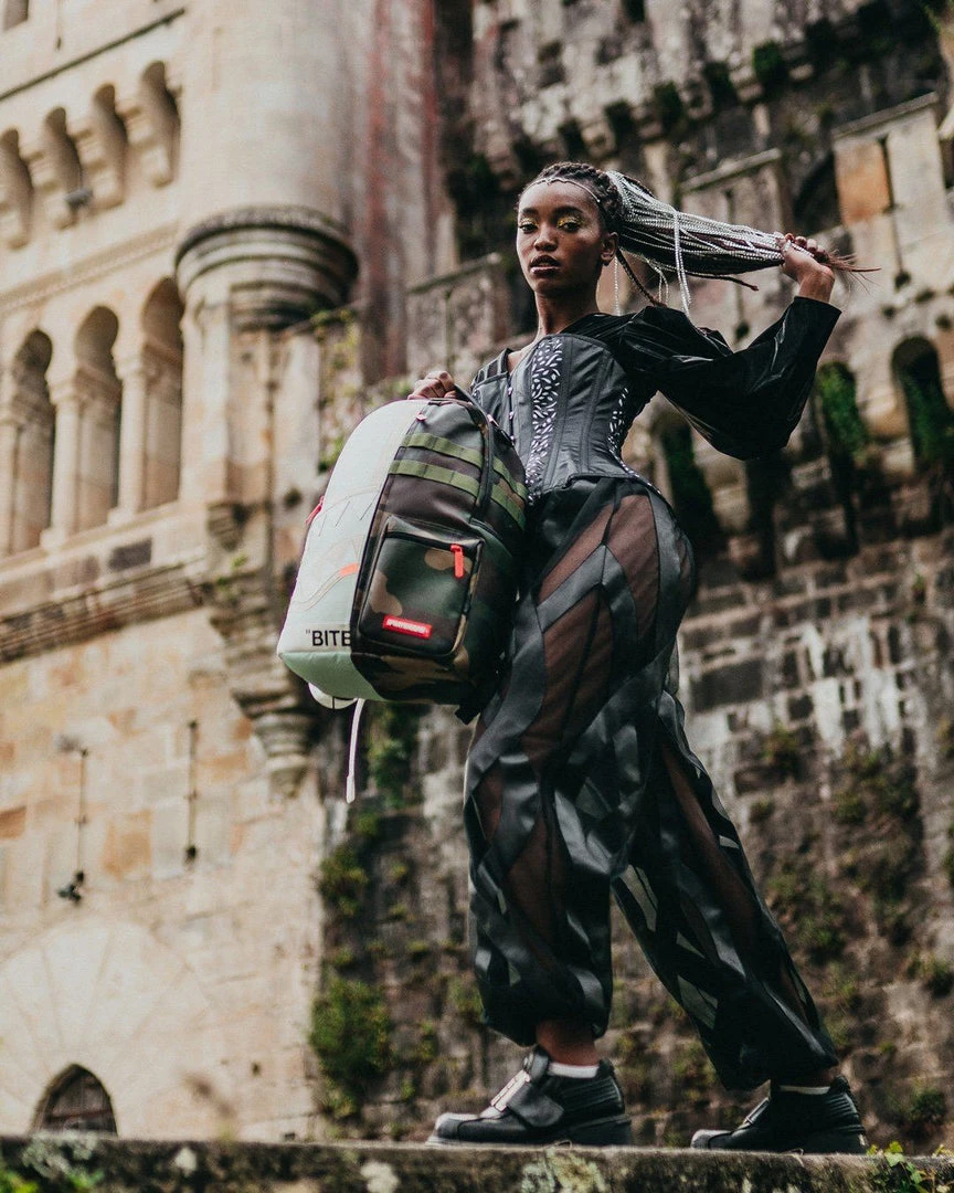 SPRAYGROUND® BAGS SPLIT WEIRD BACKPACK (DLXV) SPRAYGROUND® BAGS SPLIT WEIRD BACKPACK (DLXV)