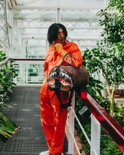 SPRAYGROUND® BAGS SHARKS AND SKULLS DUFFLE