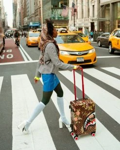 SPRAYGROUND® CARRY-ON LUGGAGE SHARKFLOWER 21.5” CARRY-ON SHARKNAUTICS LUGGAGE